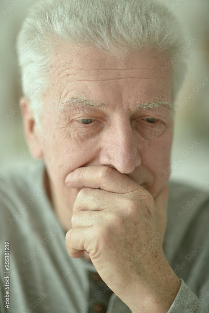 Close-up portrait of sad senior man at home Close-up portrait of sad senior man at home