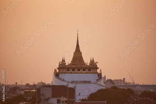 Scene of at golden mount temple before sunset