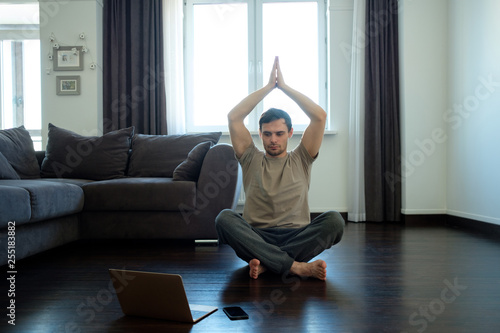 A man doing exercises at home. Healthy lifestyle concept.