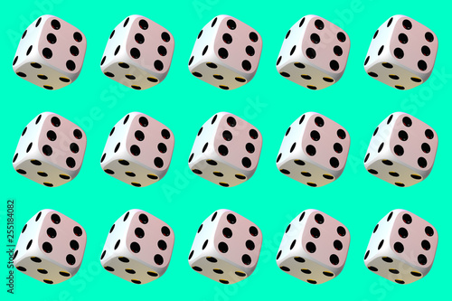 Close up of many playing dice, rotating on light green background.