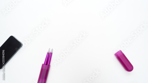 Office desk table with pen and smart phone close up Top view copy space