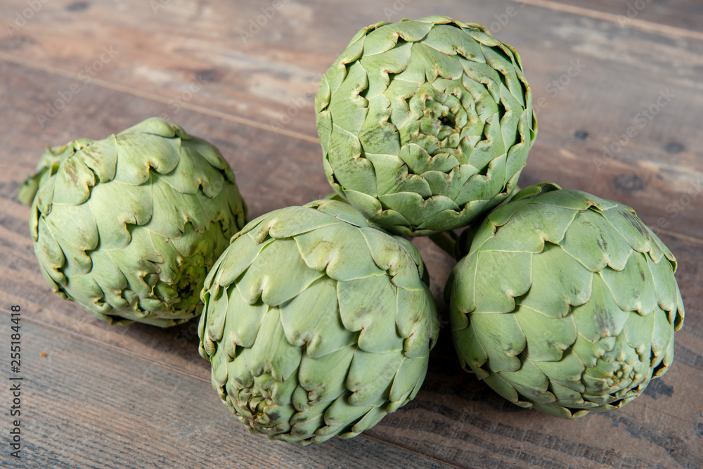 Fototapeta premium delicious artichokes on the wooden table