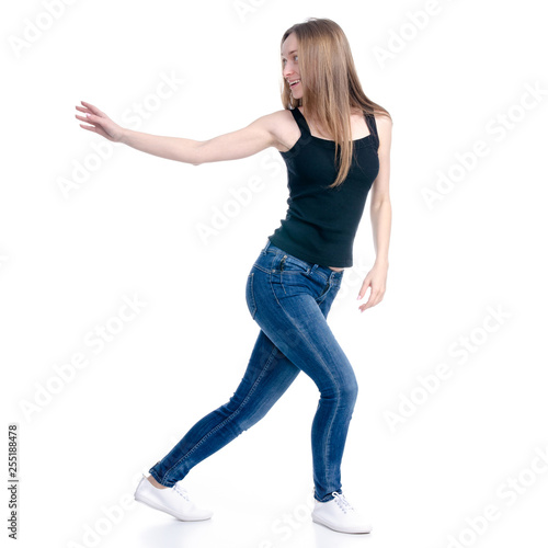 Woman in jeans standing showing pointing holding on white background isolation