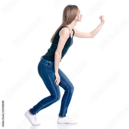 Woman in jeans t-shirt knocking on the door on white background isolation