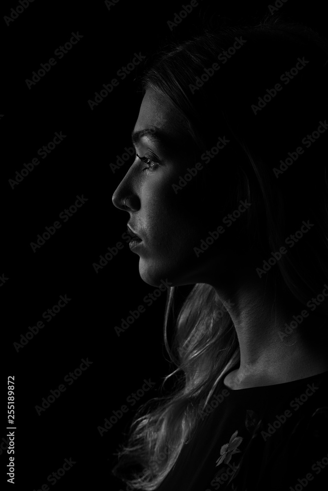 Low key black and white portrait of a beautiful young woman Low key black and white portrait of a beautiful young woman