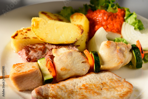 Mixed Grilled meat and vegetables decorated on a plate ready to be served in restaurant