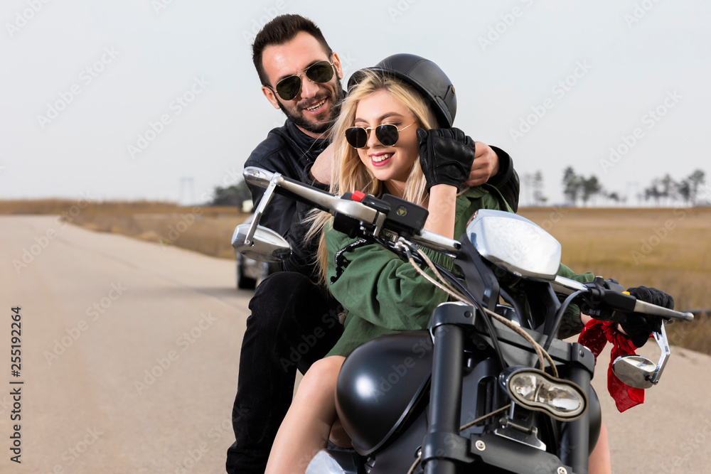 Beautiful young couple traveling Motorbike Beautiful young couple traveling Motorbike