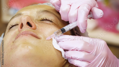 Woman gets beauty facial cosmetology procedure