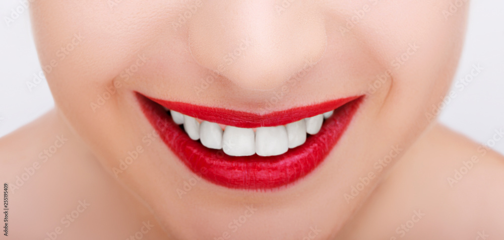 Obraz premium Beautiful young model red lips. Part of a beautiful face