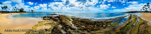 pano of beach with rocks and sand on left © Ken