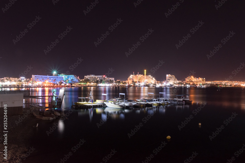 Night panoramic view on the central public beach of Eilat.