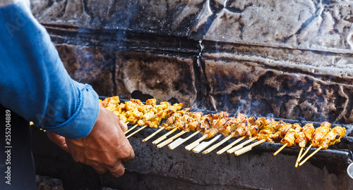 appetizer dish of traditional Thai street food recipe, Pork Satay Grilled marinated pork skewer stick barbecued on charcoal fire grill. Thailand Asia Food Travel, Fast Food, Culinary, Cuisine, Gourmet