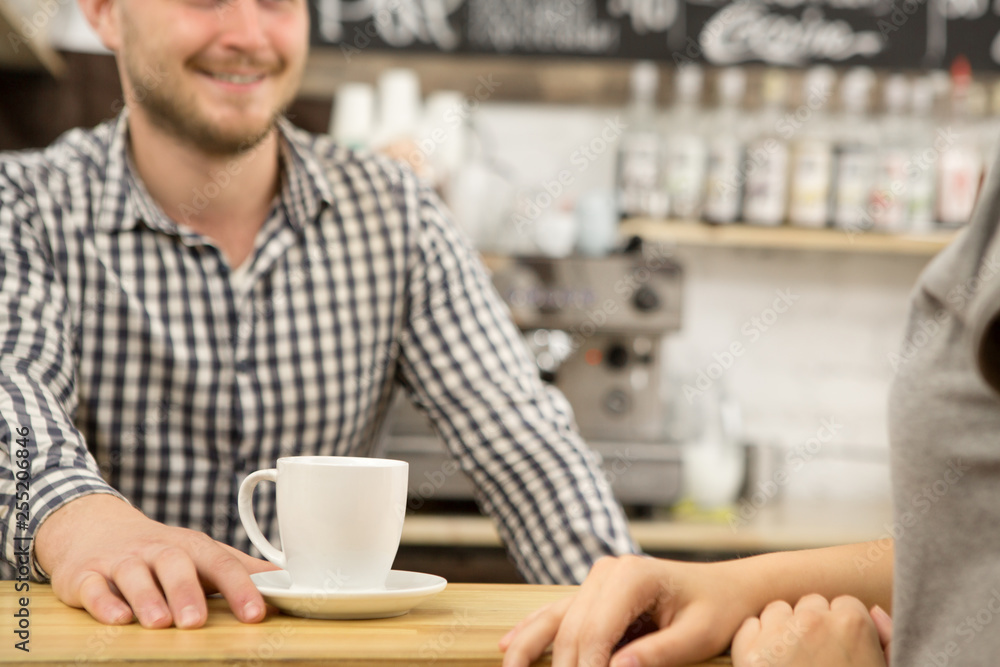 Cropped shot of a barista serving coffee to a female client at the local caffee shop positivity lifestyle urban cafe breakfast morning drink beverage service employee waiter profession occupation frie Cropped shot of a barista serving coffee to a female client at the local caffee shop positivity lifestyle urban cafe breakfast morning drink beverage service employee waiter profession occupation frie