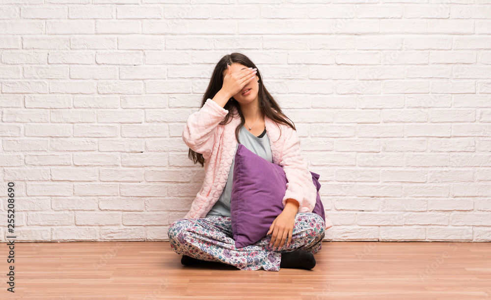 Teenager girl in pajamas covering eyes by hands. Do not want to see something Teenager girl in pajamas covering eyes by hands. Do not want to see something