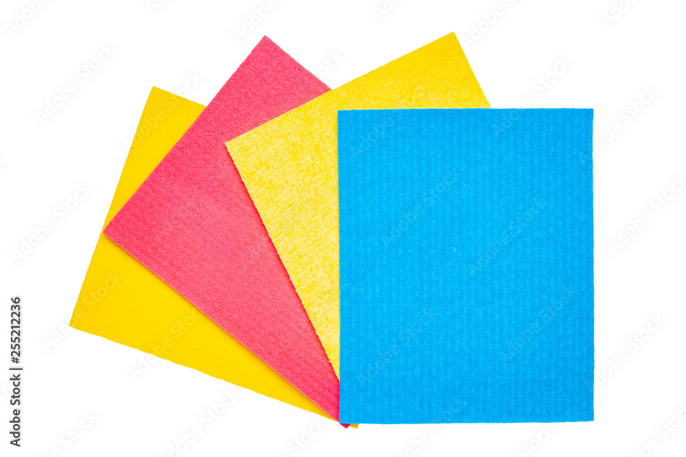 Close-up of various colorful sponges or scouring pads isolated on a white background. Household chore concept. Top view.