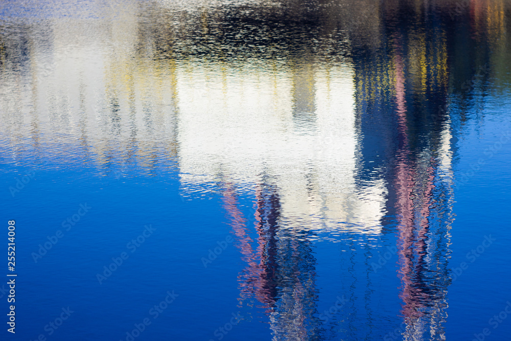 beautiful reflection in the water of the drilling rig