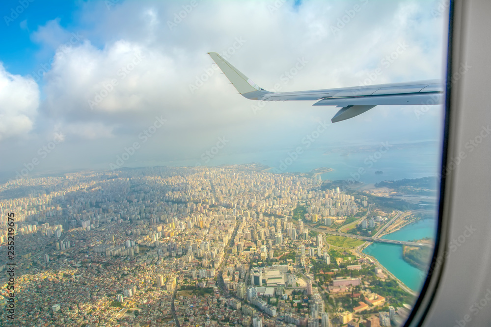 passenger plane flying over the city passenger plane flying over the city
