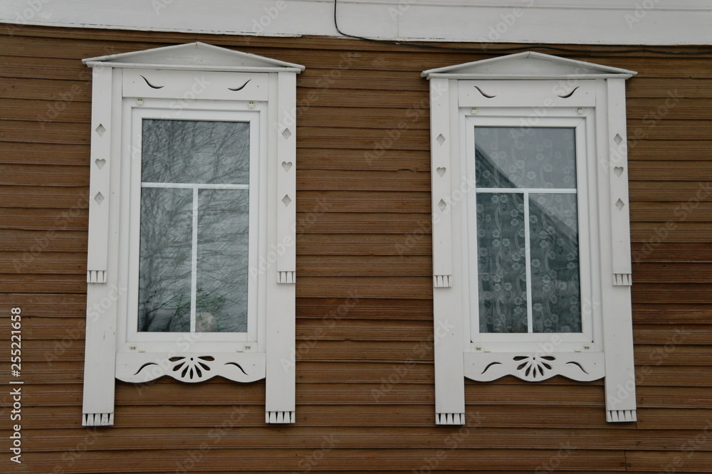 white wooden carved frames by the window white wooden carved frames by the window
