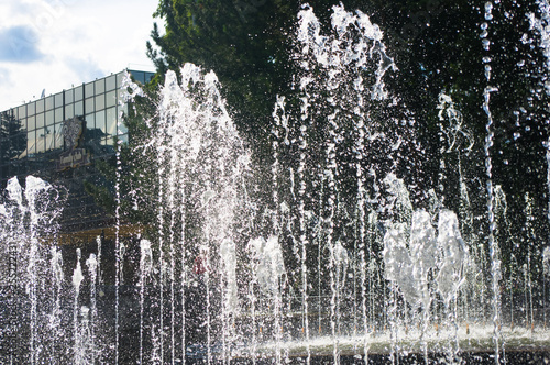 Fountain in city park on hot summer day