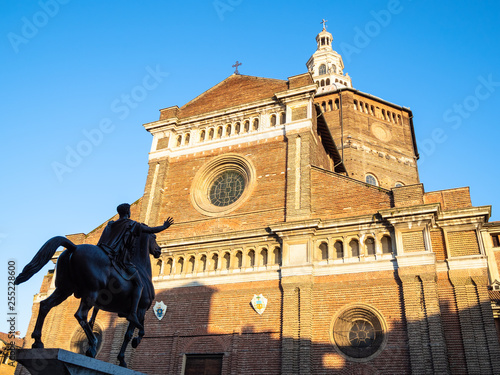 Duomo di Pavia and statue Regisole in sunset light photo