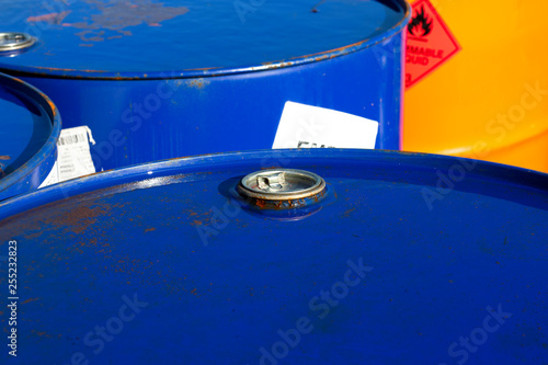 Top of 200 litre 55 US gallon empty gasoline drums in storage area awaiting pick up