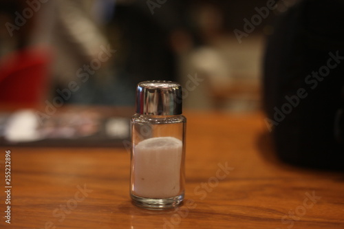 glass of beer on wooden table in a cafe