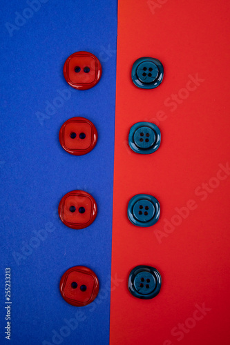 blue buttons on red background and red buttons on blue background separated in the middle