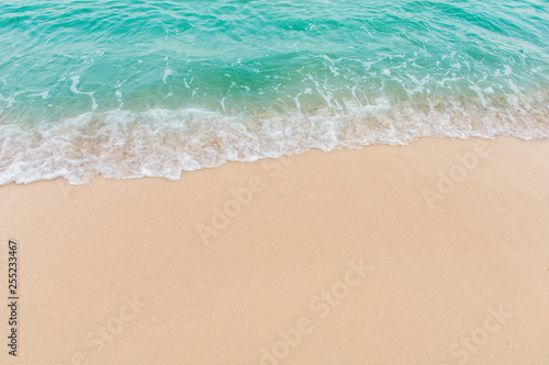 Fototapeta Naklejka Na Ścianę i Meble -  Soft wave of sea on empty sandy beach Background with copy space
