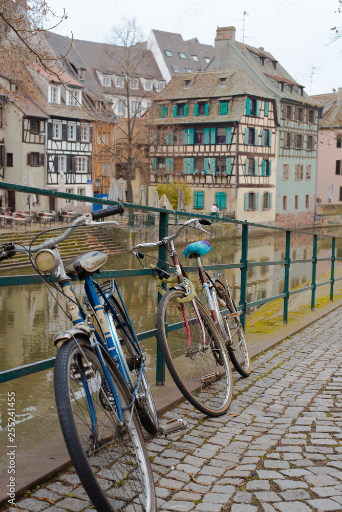 Bicycles Resting on Footpath by River