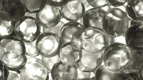 Colorless hydrogel balls closeup, movement