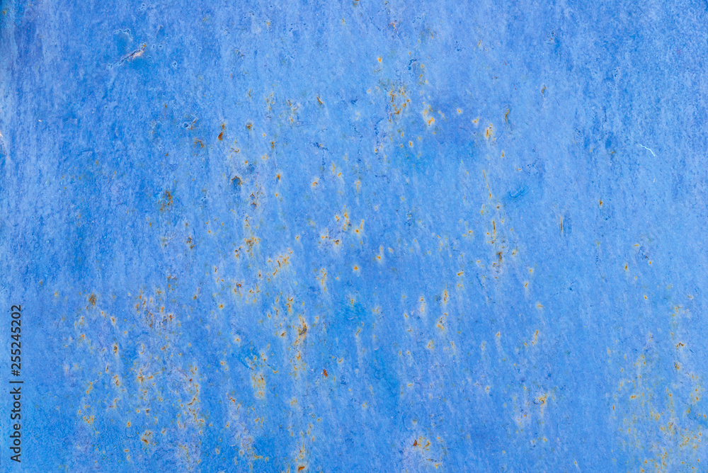 Texture of old battered concrete wall of blue color