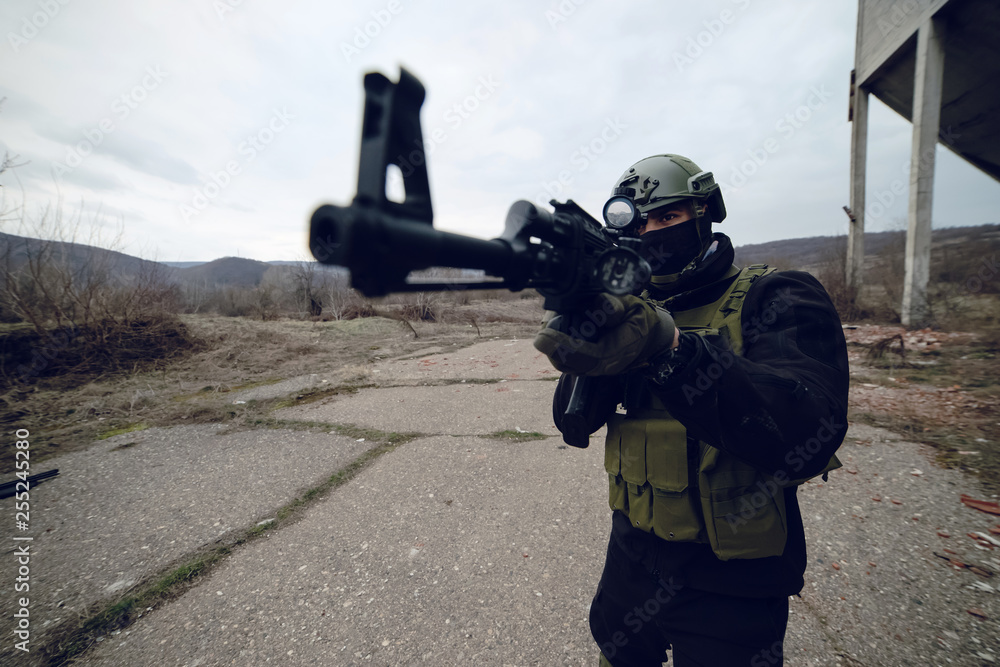 Air soft training outdoor man in uniform holding the gun Air soft training outdoor man in uniform holding the gun