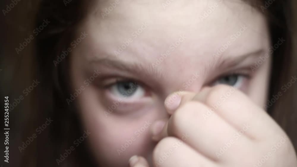 Closeup portrait of a beautiful young tired girl rubbing her eyes with fatigue. concept of eye fatigue and poor eyesight. Closeup portrait of a beautiful young tired girl rubbing her eyes with fatigue. concept of eye fatigue and poor eyesight.