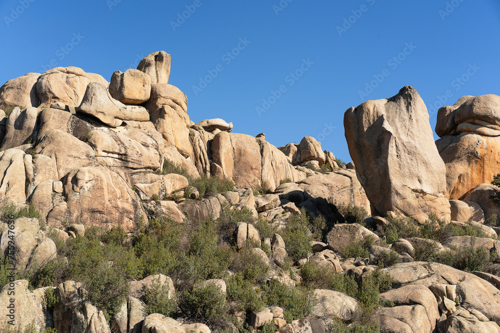 Panoramic view of granite rocks in La Pedriza, National Park of mountain range of Guadarrama in Manzanares El Real, Madrid, Spain.
