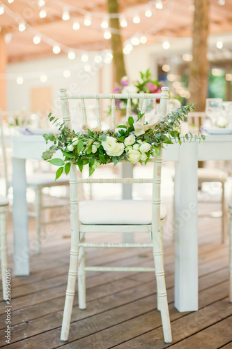 chairs with flowers and eucalyptus