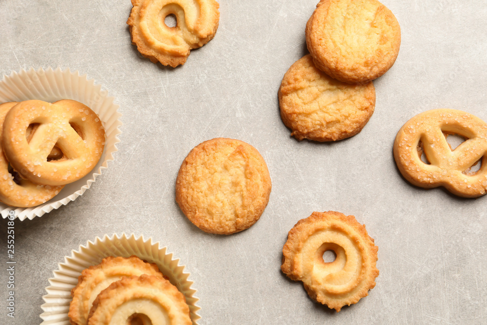 Tasty Danish butter cookies on grey background, flat lay Tasty Danish butter cookies on grey background, flat lay