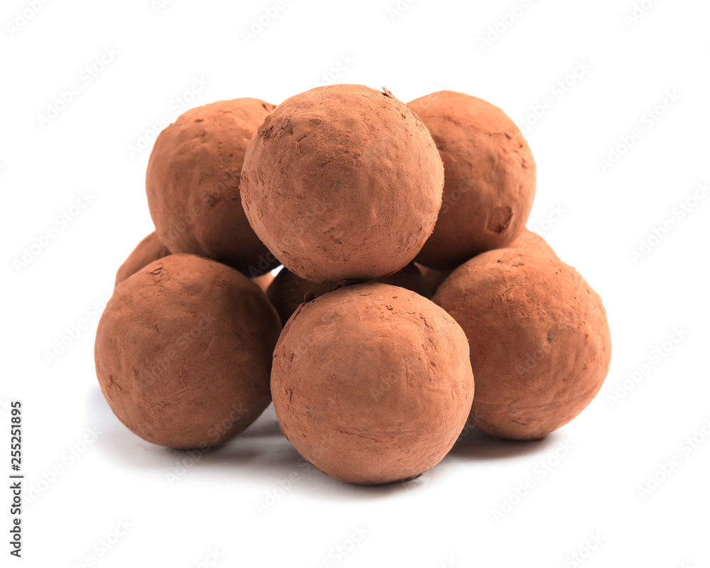Delicious raw chocolate truffles on white background Delicious raw chocolate truffles on white background