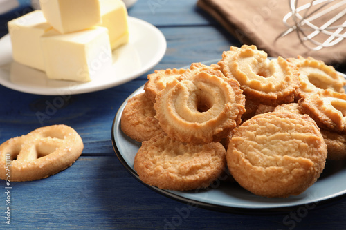 Plate with Danish butter cookies on table. Space for text