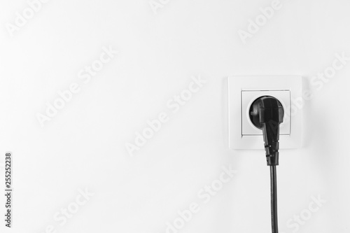 Power socket and plug on white background. Electrician's equipment
