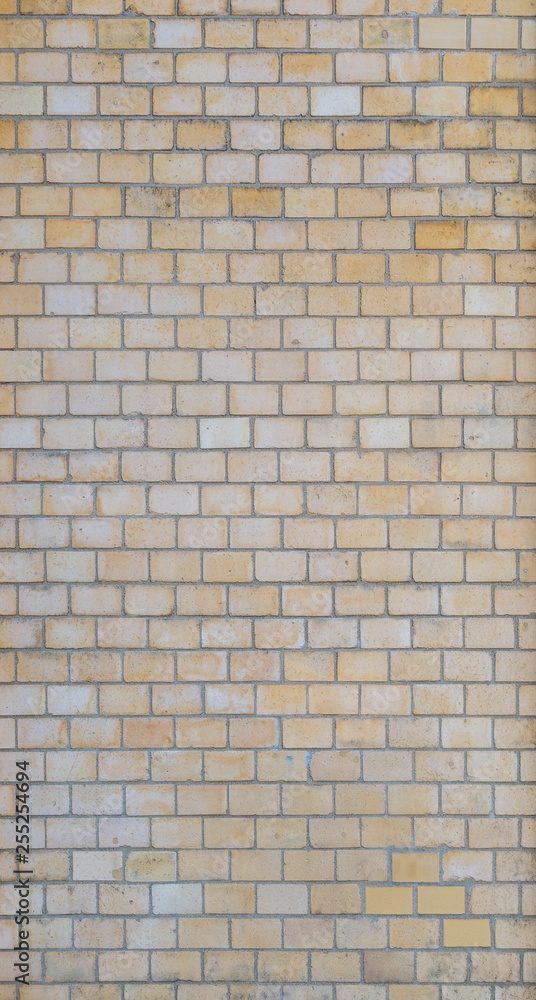 Full frame background of detailed old light yellow brick wall. Full frame background of detailed old light yellow brick wall.