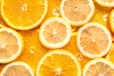 Slices of citrus fruits as background, top view