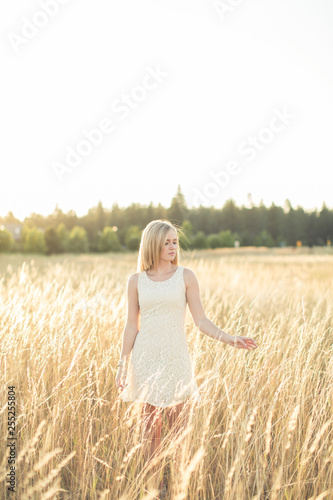 pretty girl standing in field