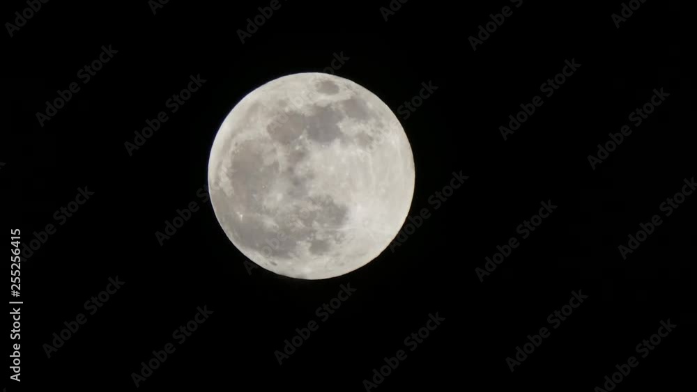 bit of eclipse showing on super moon in dark sky bit of eclipse showing on super moon in dark sky