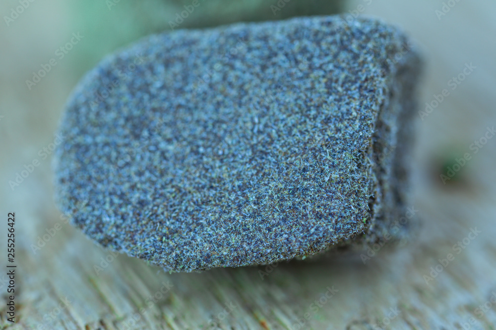 Medical Cannabis CBD Hashish on the piece of fresh oak wood - macro view. Medical Cannabis CBD Hashish on the piece of fresh oak wood - macro view.