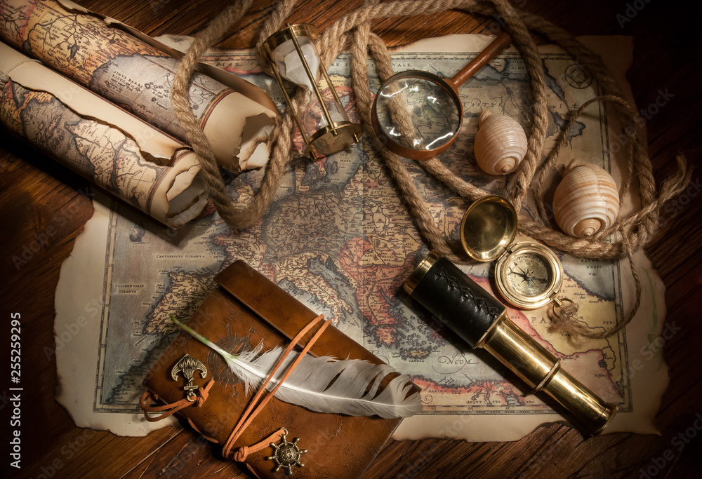 Old maps and vintage objects on a wooden table