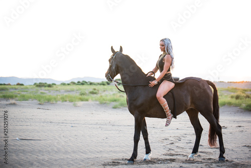 Arabian horse  a girl  and the desert