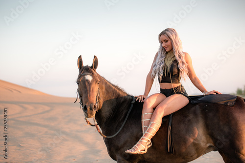 Arabian horse, a girl, and the desert