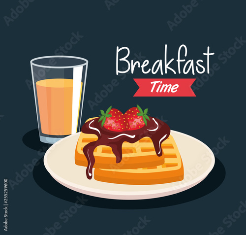 delicious waffles with strawberries and orange juice