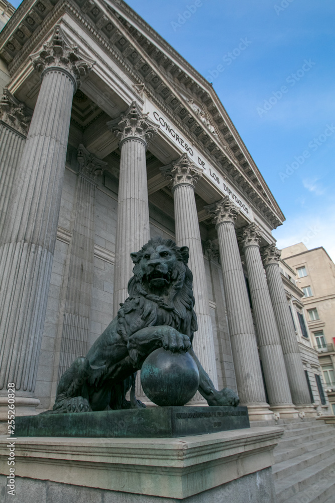 Main facade of the Spanish Parliament House with the lions on the entrance, Madrid, Spain)