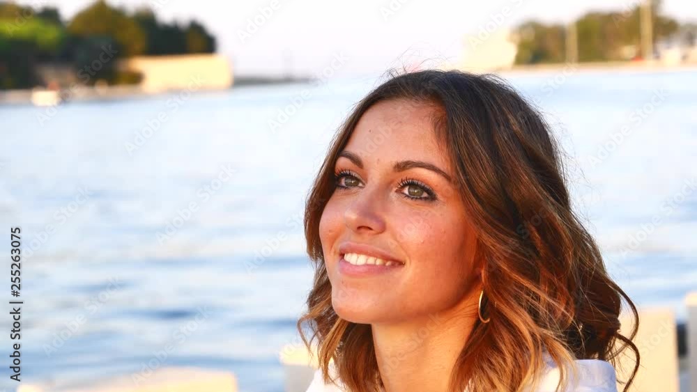 Portrait of Attractive Smiling Caucasian Ethnicity Young Woman near the port Portrait of Attractive Smiling Caucasian Ethnicity Young Woman near the port